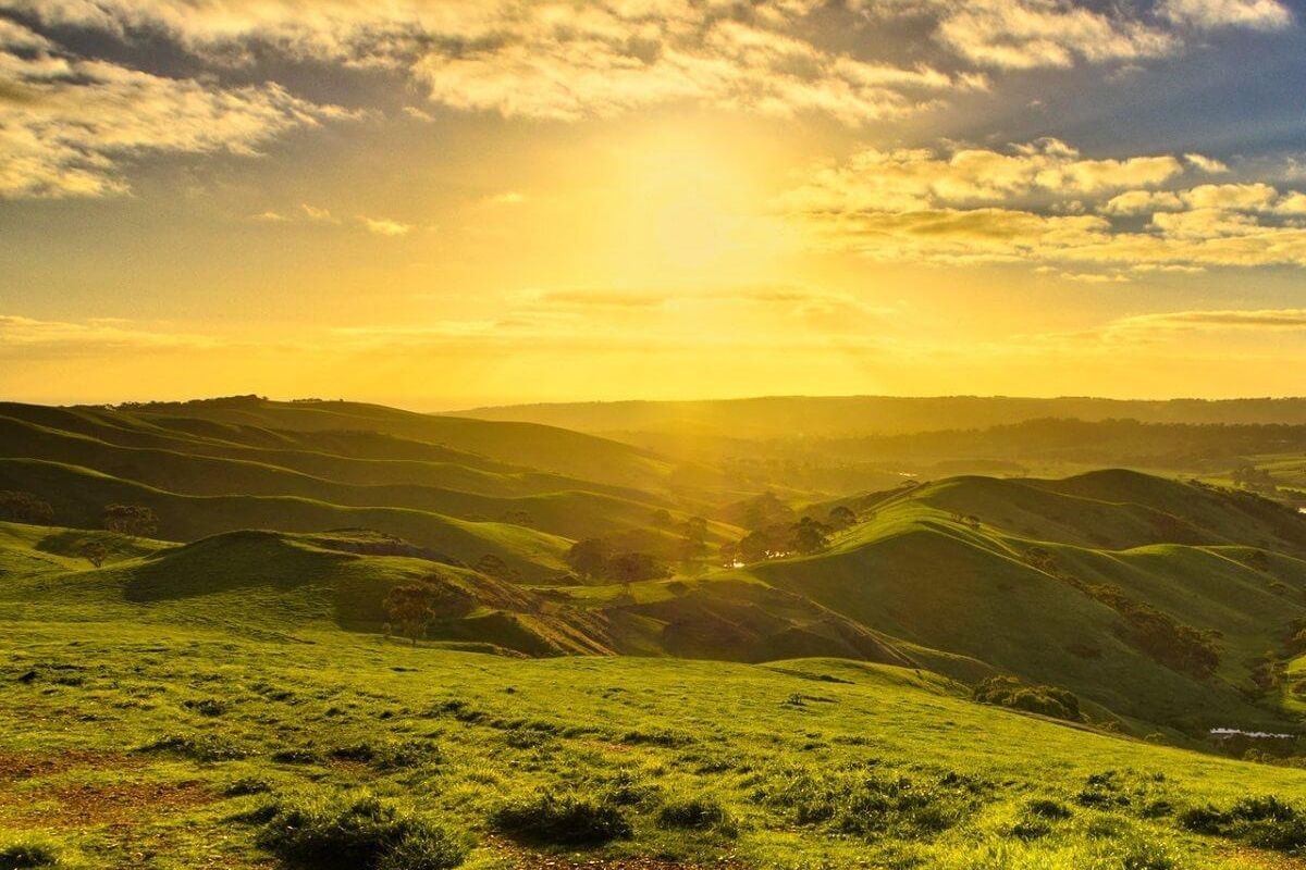 The first rays of the Indian sunrise illuminating the mountains of Dong Valley, a unique best place to visit in Arunachal Pradesh.