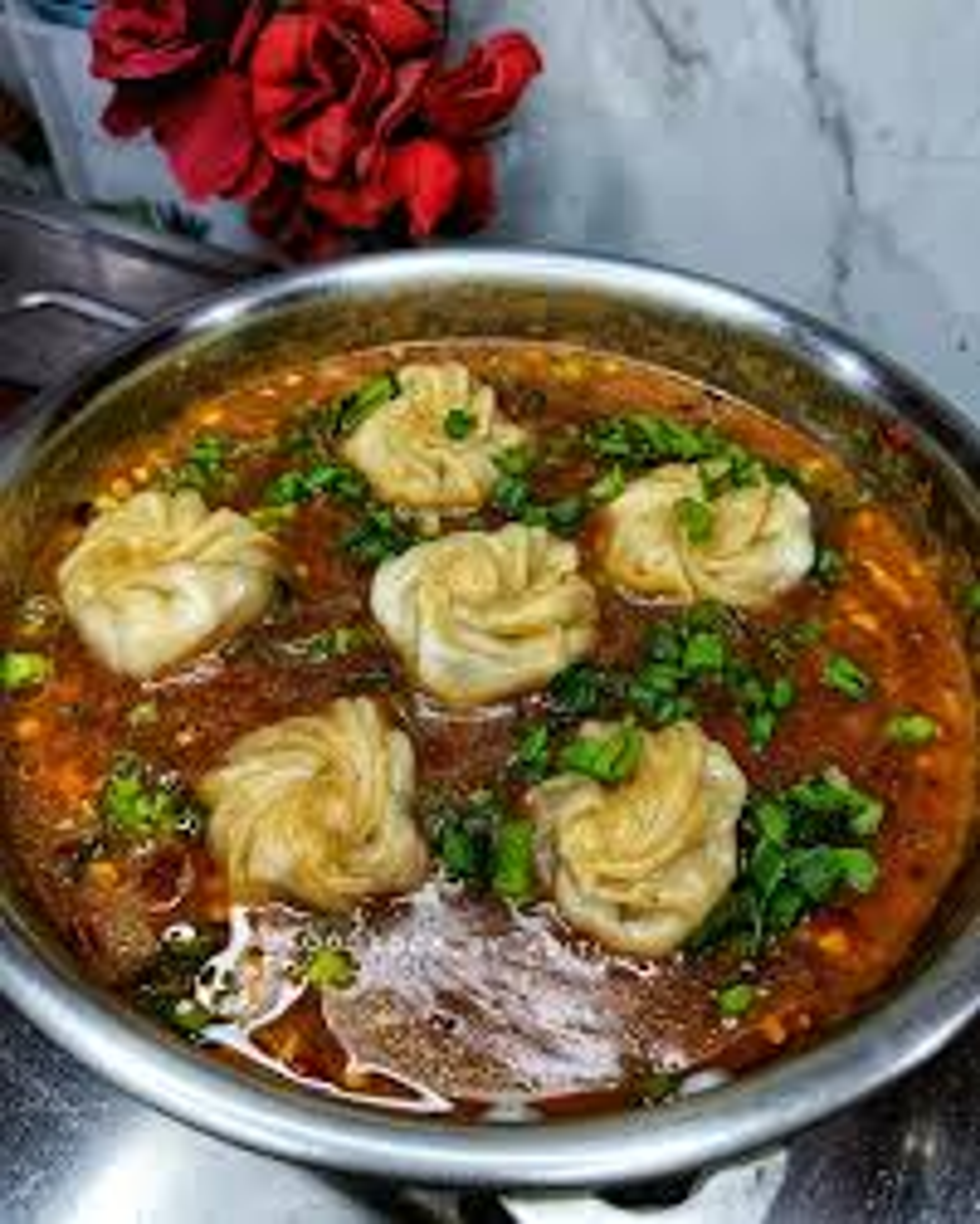 Traditional Monpa cuisine including Thukpa and hand-rolled momos in Bomdila, Arunachal Pradesh.]