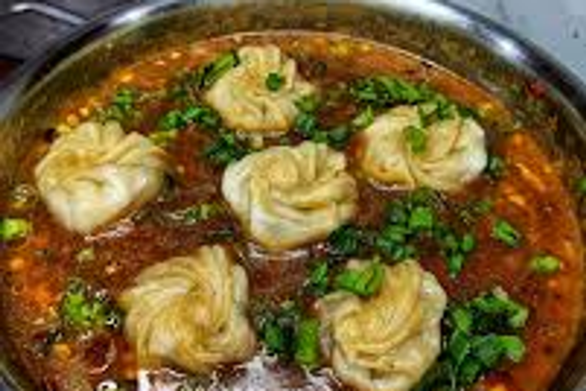 Traditional Monpa cuisine including Thukpa and hand-rolled momos in Bomdila, Arunachal Pradesh.]