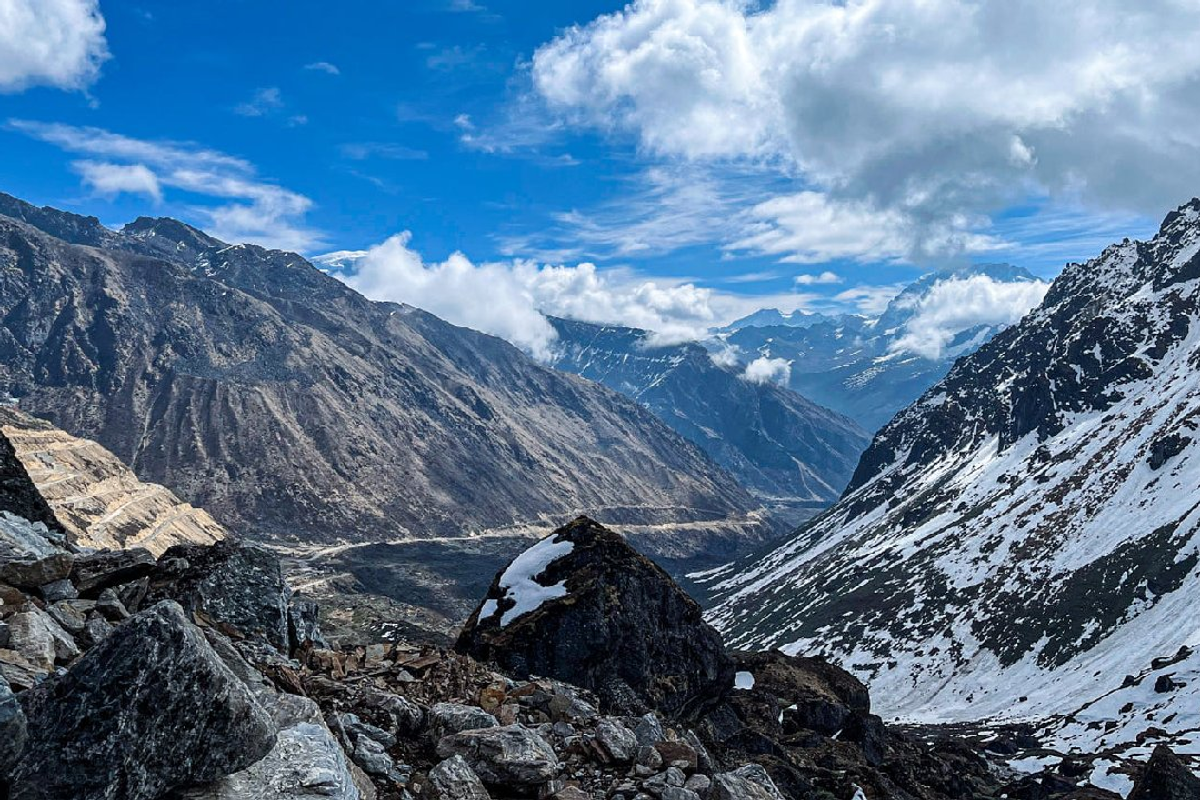 The dramatic black rocks of Kalapatthar are covered in a thick blanket of white snow.