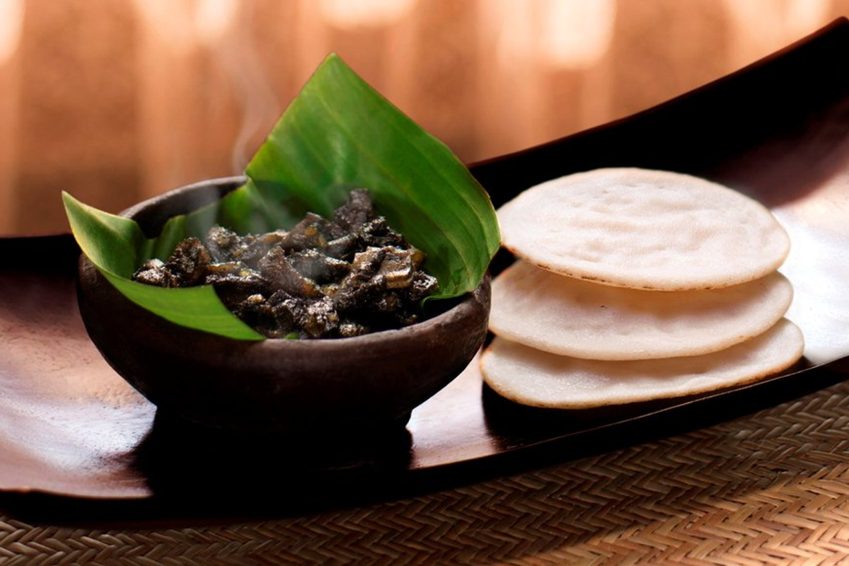 Putharo steamed rice pancake served with Dohjem pork offal from Meghalaya street food