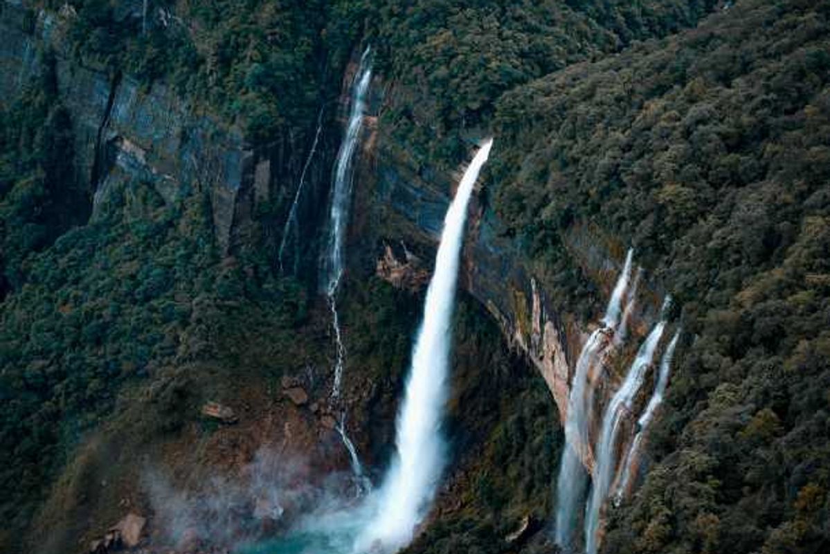 Shillong city life vs Cherrapunji nature landscape comparison.]