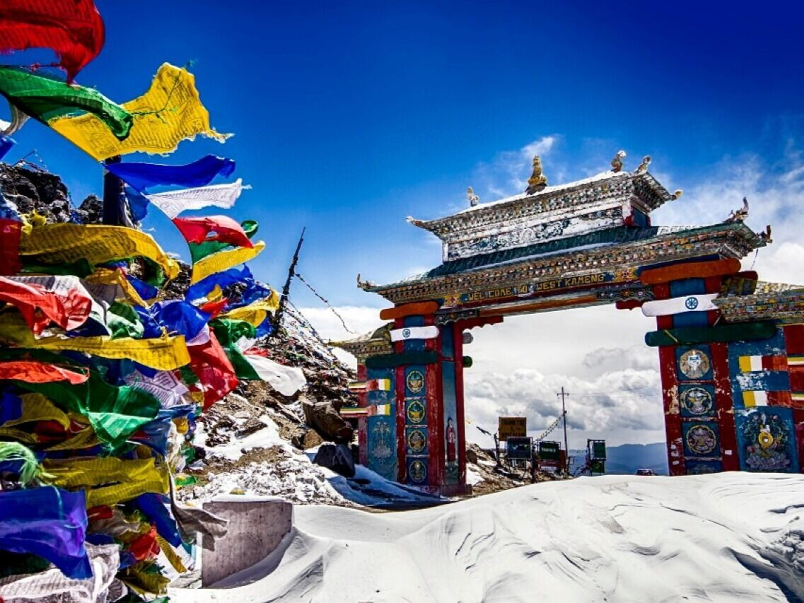 Colorful Tawang Gate entrance at Sela Pass, the gateway to Tawang Arunachal Pradesh, featuring traditional Monpa architectural designs.