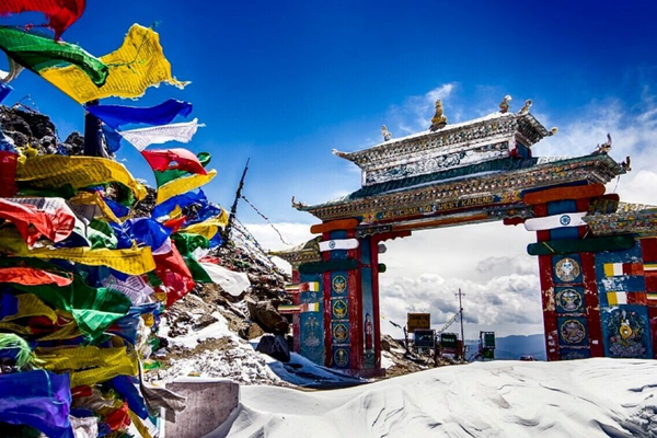 Colorful Tawang Gate entrance at Sela Pass, the gateway to Tawang Arunachal Pradesh, featuring traditional Monpa architectural designs.