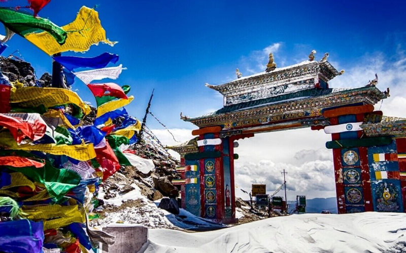 Colorful Tawang Gate entrance at Sela Pass, the gateway to Tawang Arunachal Pradesh, featuring traditional Monpa architectural designs.