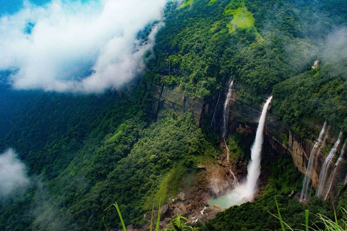 Nohkalikai Falls in Cherrapunji Meghalaya showing the tallest plunge waterfall and its emerald green pool.
