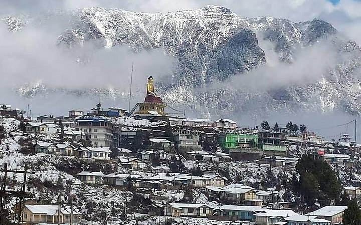 Tawang town view with Buddha statue.