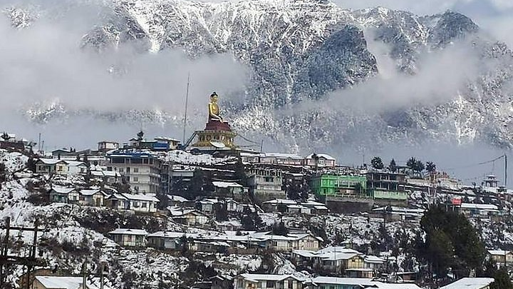 Tawang town view with Buddha statue.