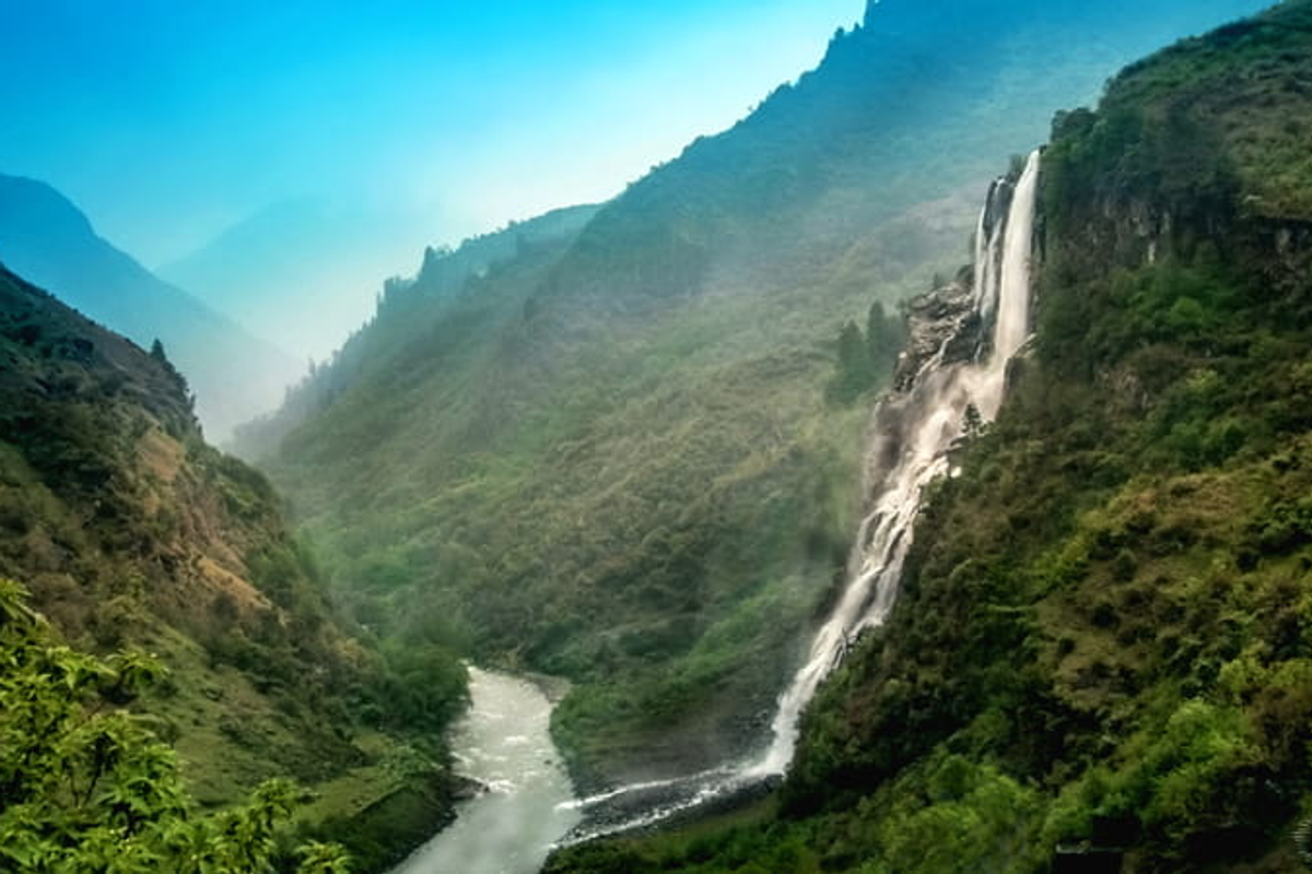 The massive Nuranang Falls (Jang Falls) cascading down a rocky cliff in Tawang.