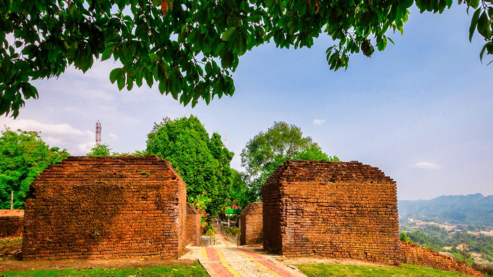 Ita Fort 14th-century brick ruins surrounded by lush green forest in Itanagar, Arunachal Pradesh, with nearby Ganga Lake and tribal culture.