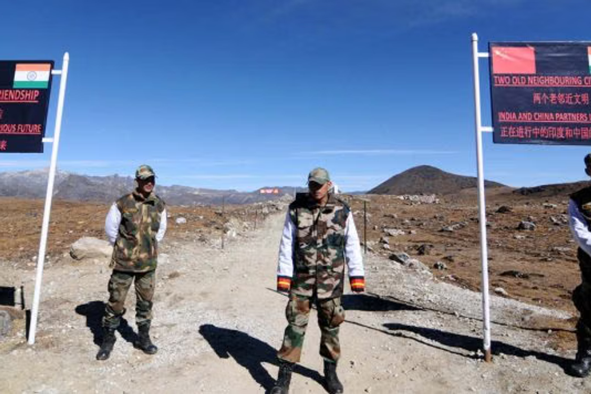 : Indian Army personnel assisting tourists at a high-altitude checkpost in Arunachal Pradesh.