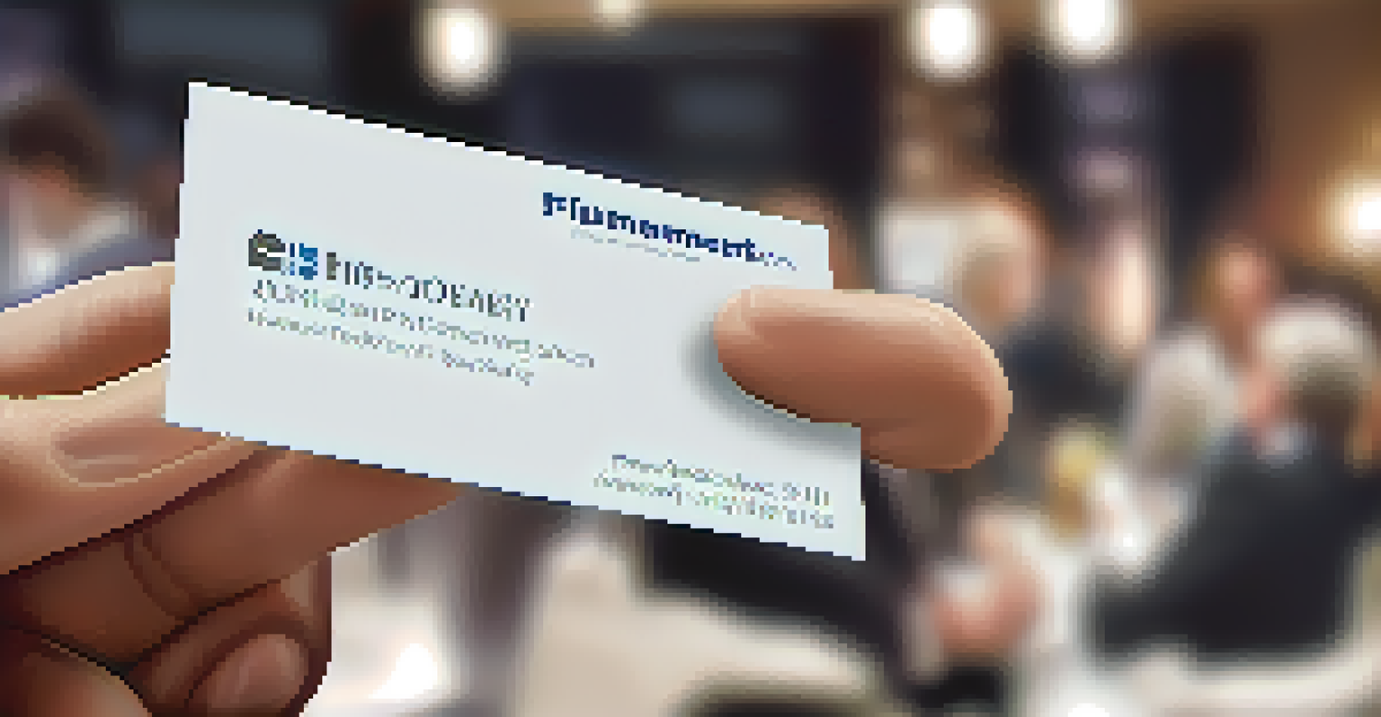 A close-up of a hand holding a business card at a networking event, with a blurred background of attendees.