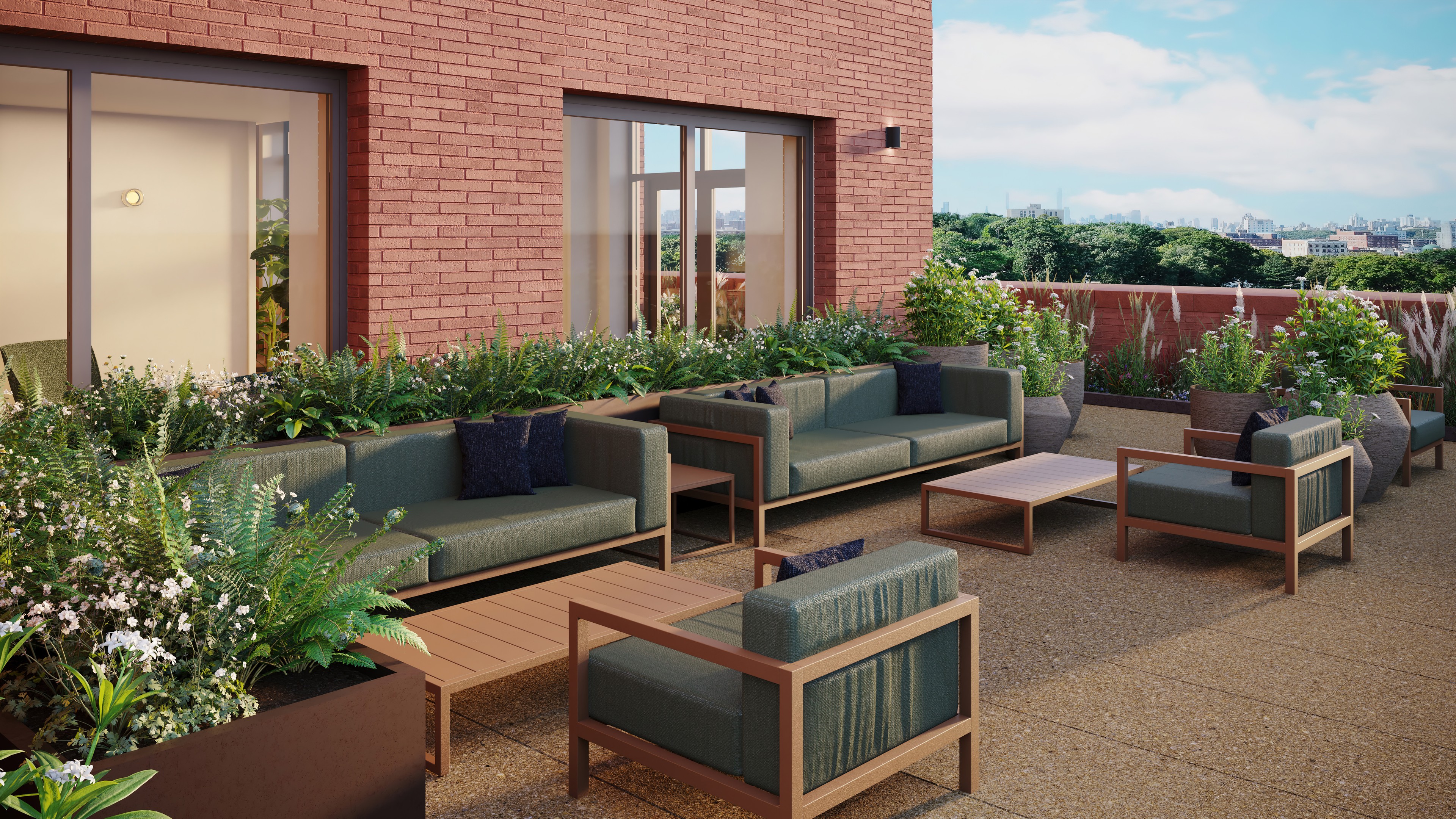 The park terrace at Ray Harlem, with outdoor lounge seating and planters overlooking Harlem and uptown Manhattan.