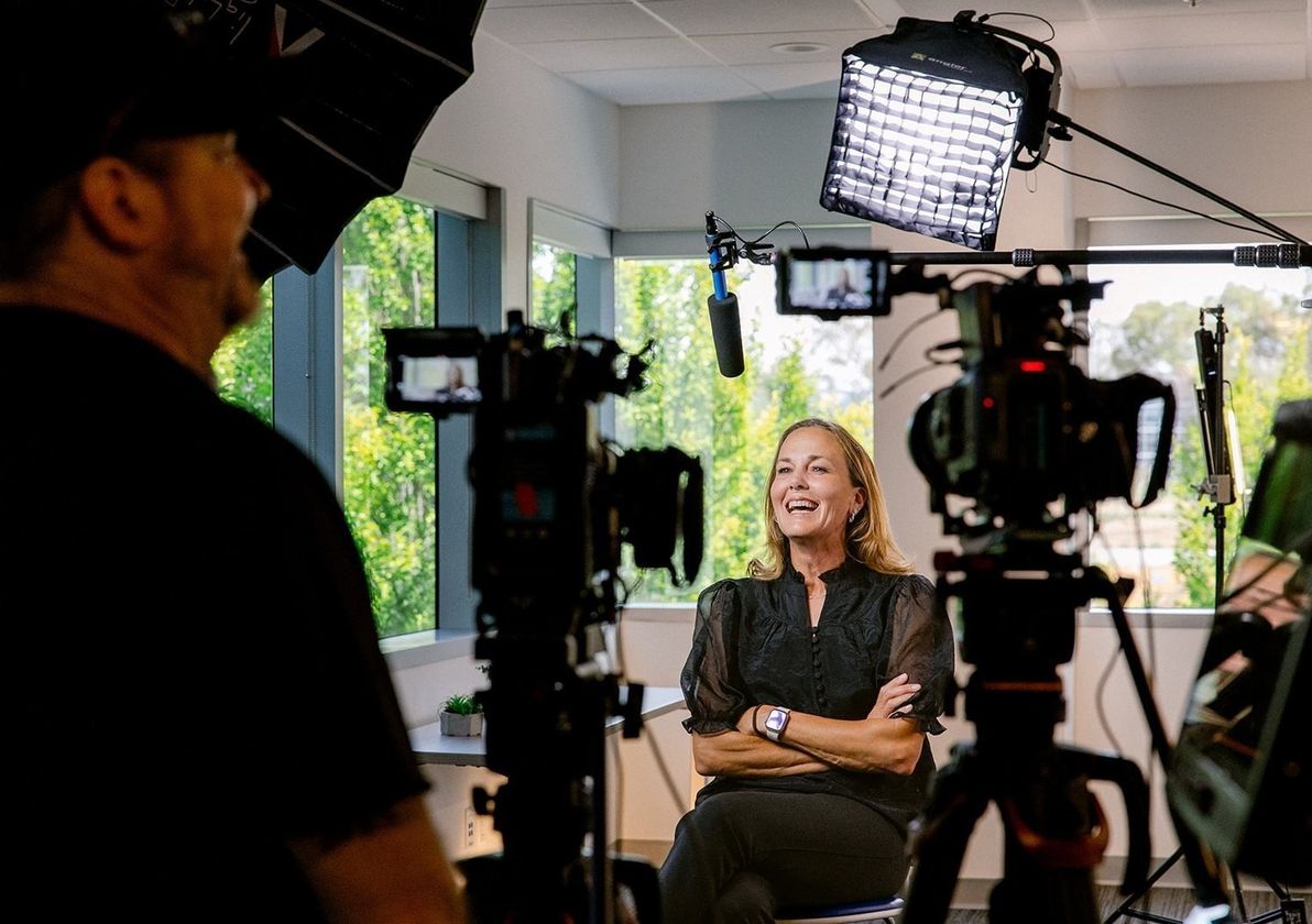 A team member being filmed on a camera rig in the office