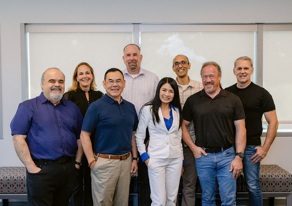 The NUVACORE team standing together in the office
