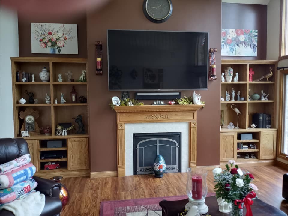 Custom living room built-ins surrounding a fireplace