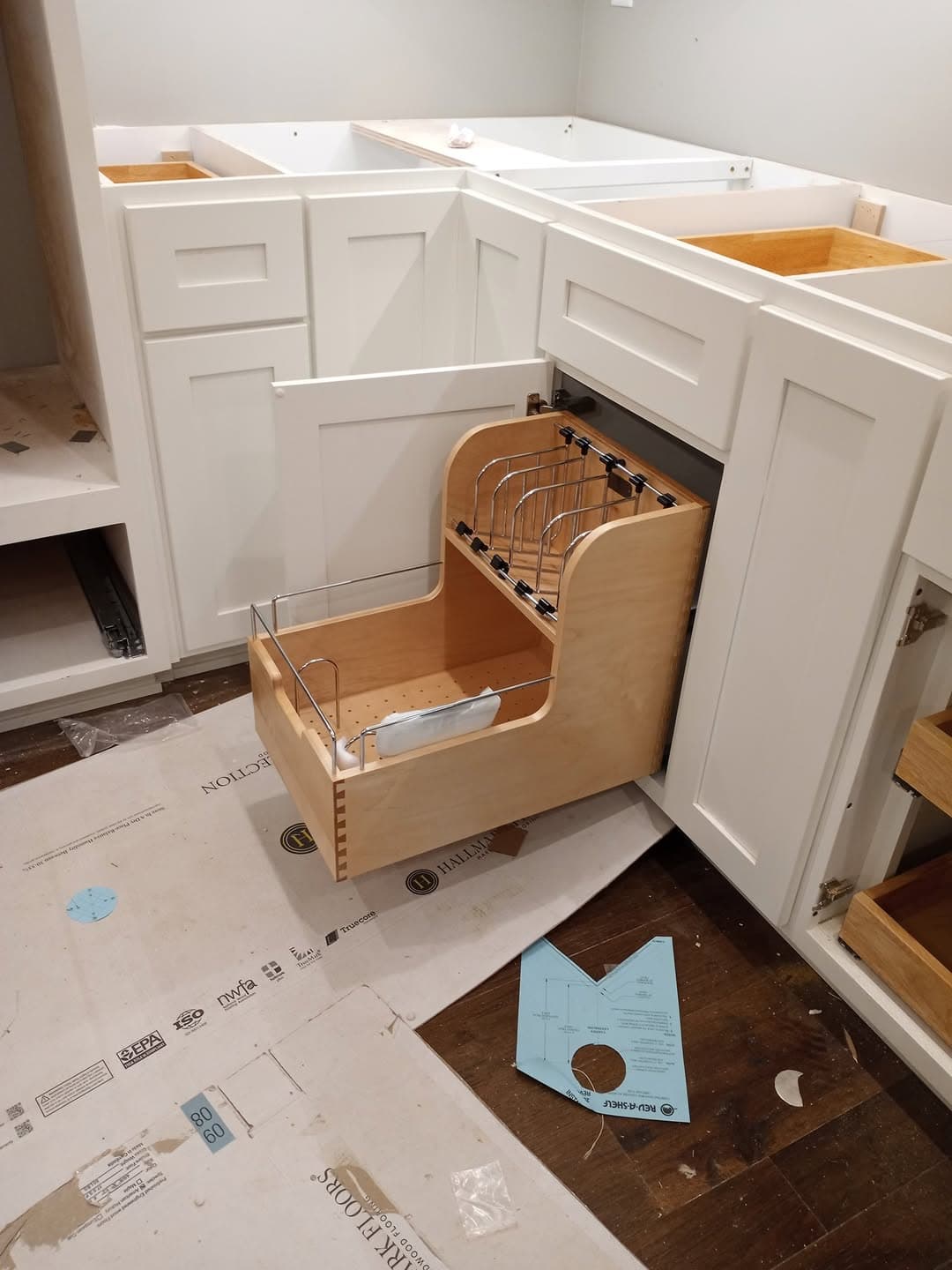 Custom kitchen renovation with dark island and bright cabinetry
