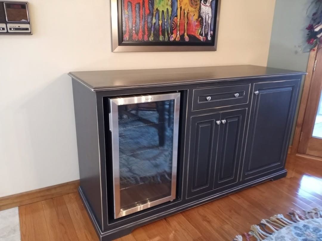 Custom dark beverage cabinet with glass-front cooler
