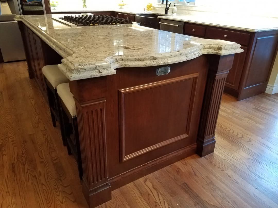 Custom cherry island with stone countertop