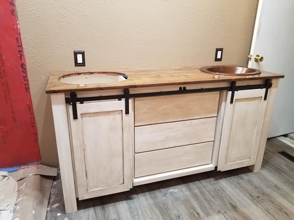 Custom unfinished island cabinetry during installation