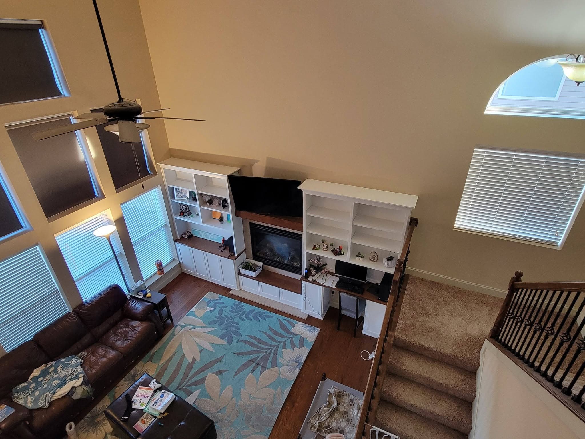 White living room entertainment built-in with cubby shelving