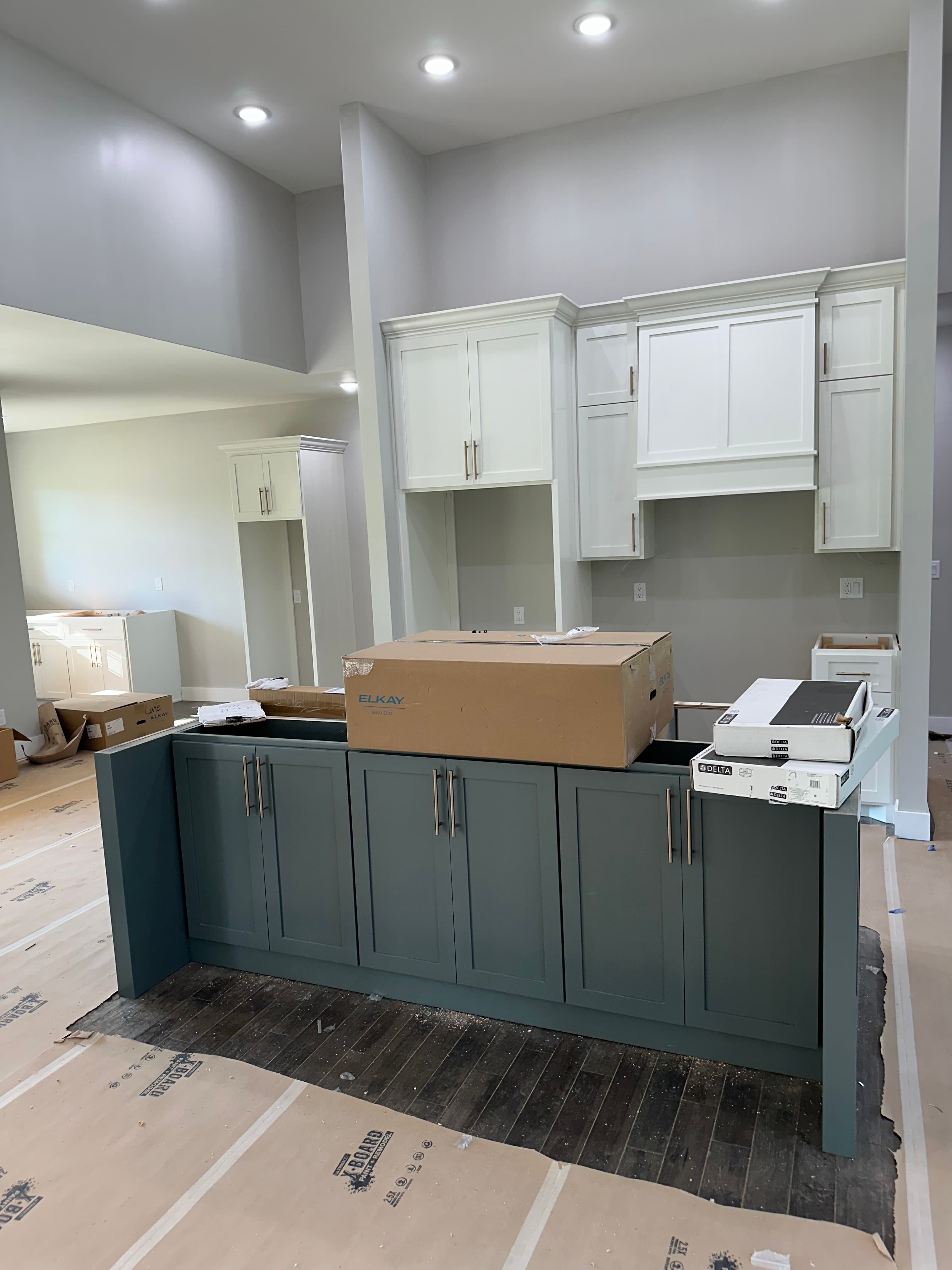 Custom white kitchen cabinetry installation