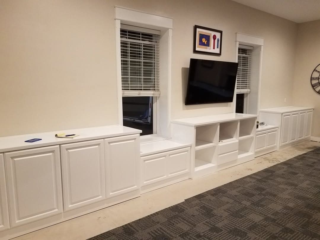 Custom white media built-in with display shelves