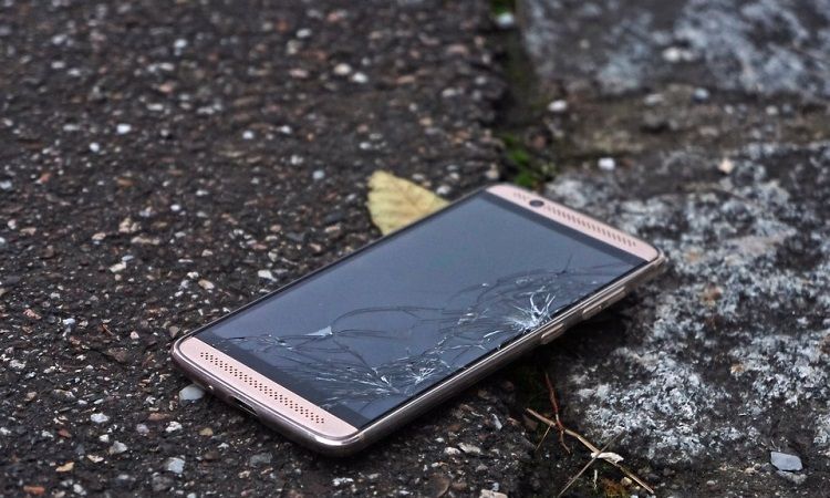 Cracked smartphone on the street