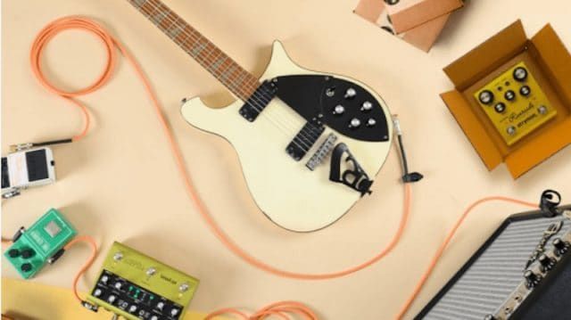 white electric guitar with other music accessories