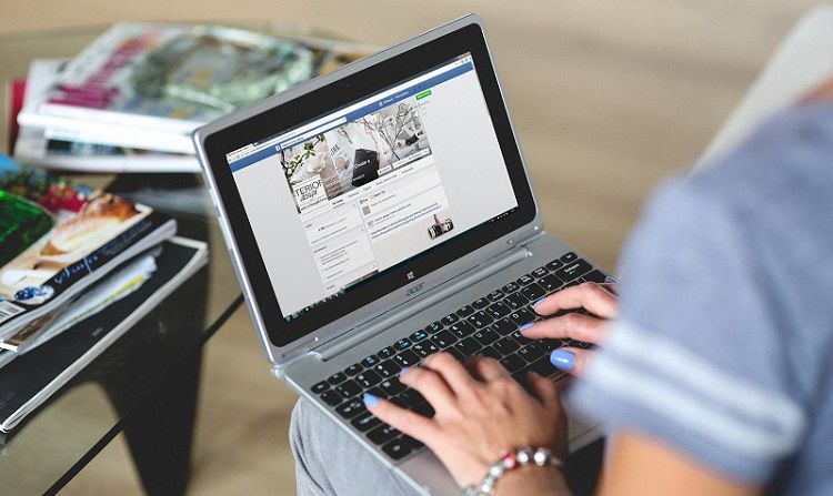 Browsing Facebook on a laptop