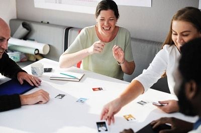Professionals playing games in a conference room