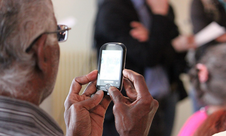 Senior using cell phone