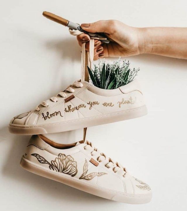 plant growing from a pair of shoes