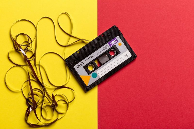A cassette with its tape pulled out