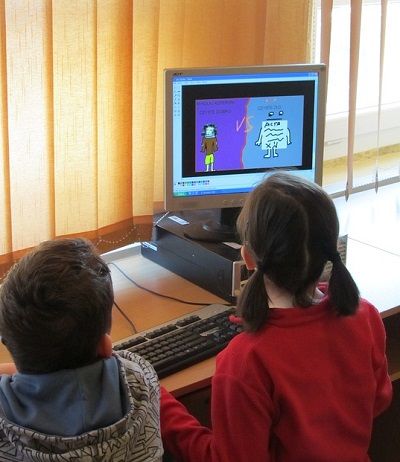 Children using a computer at a school