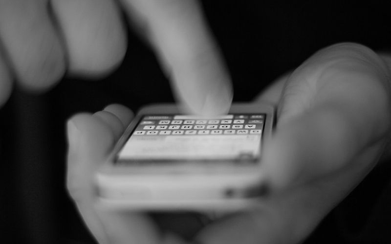 Someone typing an iMessage on an iPhone