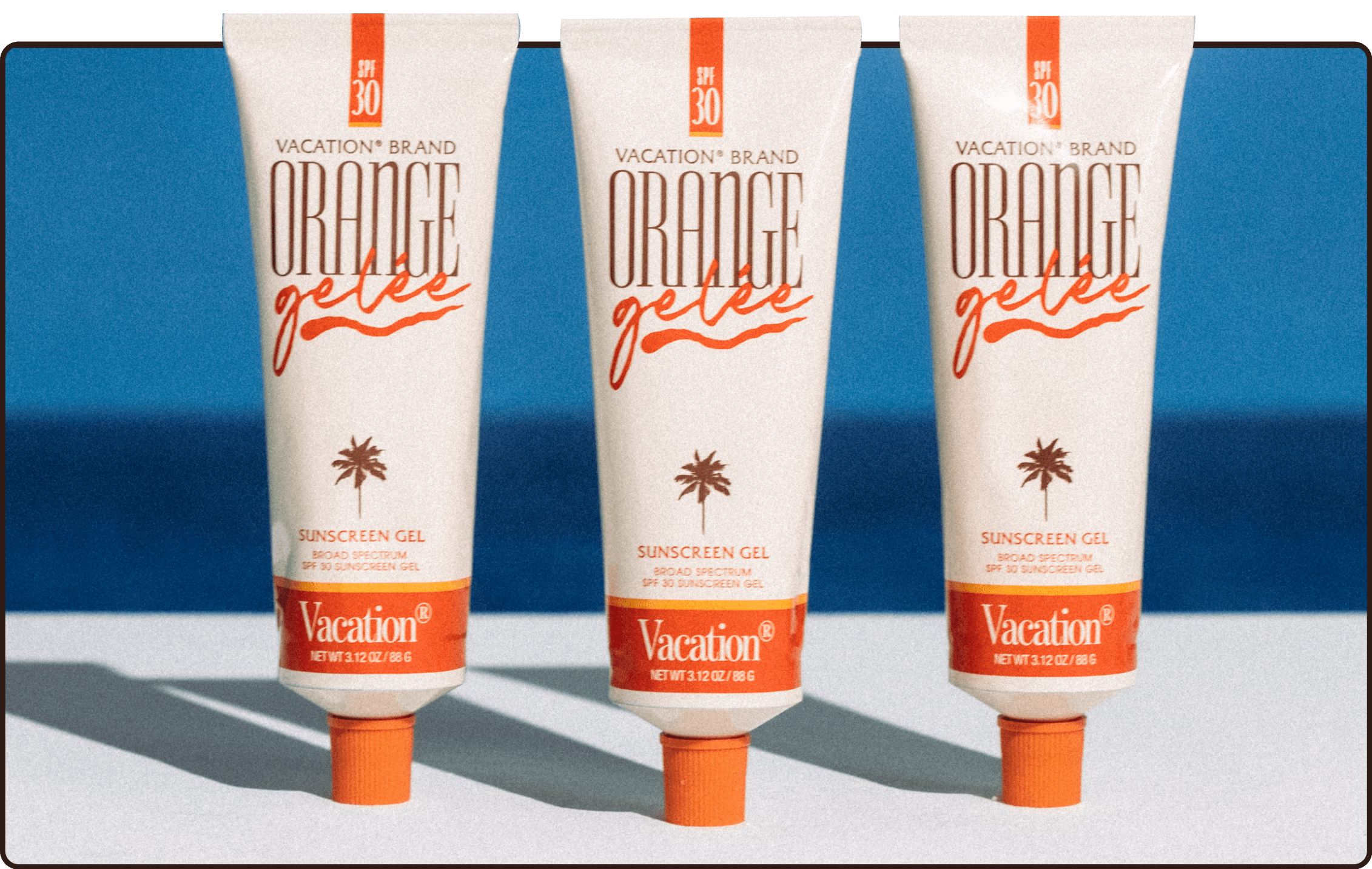 three tubes of orange vacation brand sunscreen gel