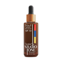 a brown bottle of vacation studio tone spf 50