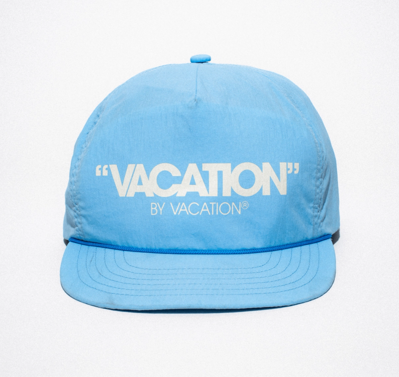 a light blue hat that says vacation by vacation