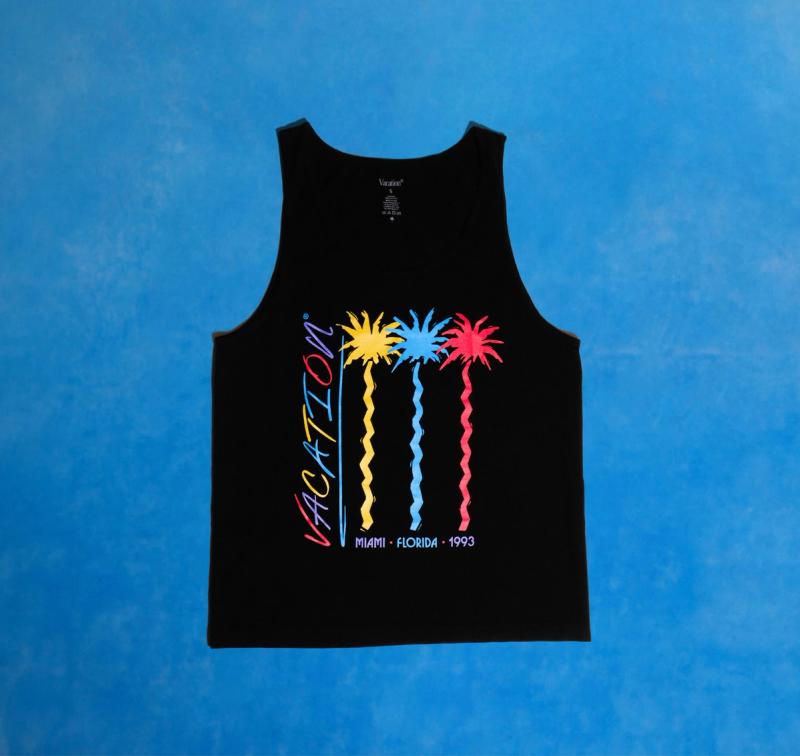 A Black Vacation® Jazz Palms tank on a blue background