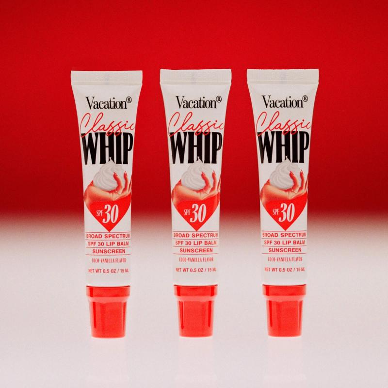 Three white tubes of Vacation Classic Whip SPF 30 lip sunscreen