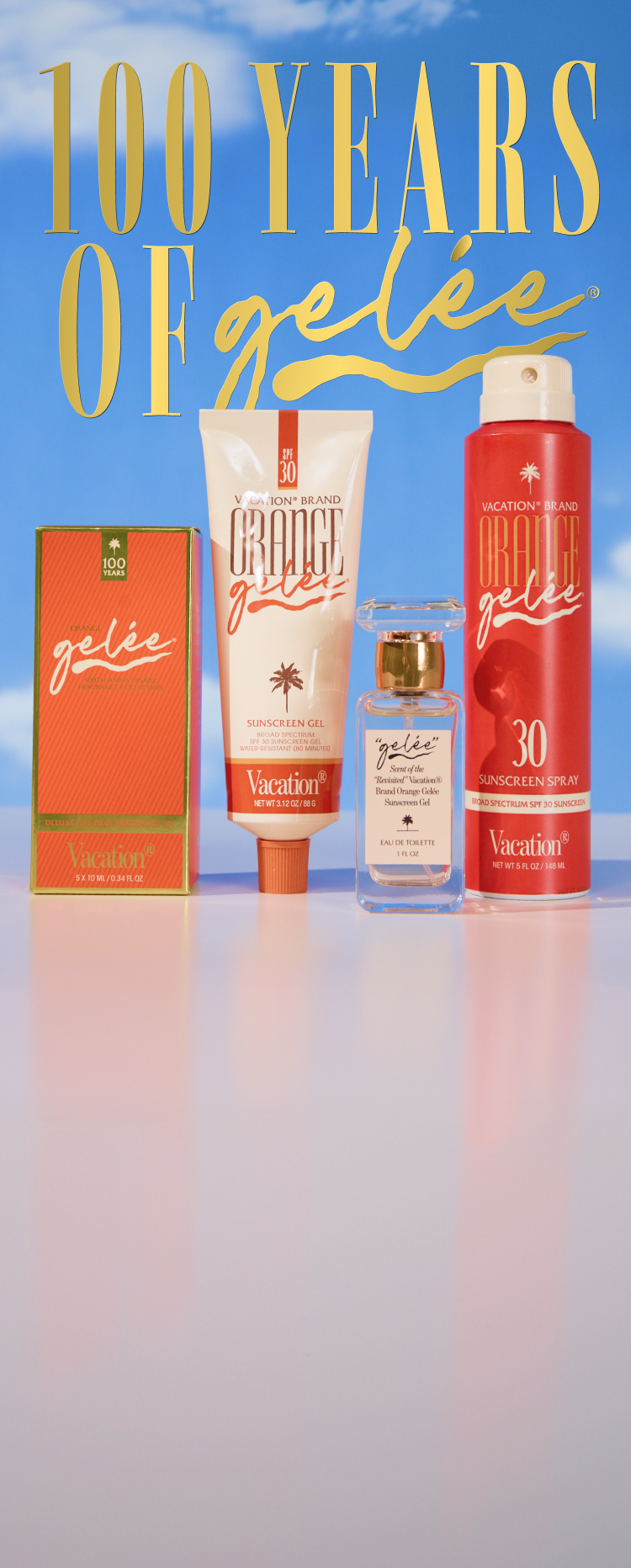 Four "Vacation Brand Orange Gelée" products: a box, sunscreen gel, perfume, and sunscreen spray, against a blue sky.