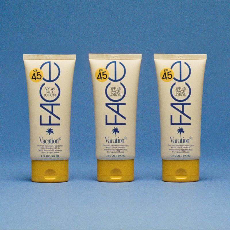 Three tubes of Vacation SPF 45 Face Lotion on a blue background.