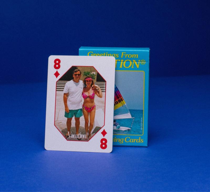 box and playing card with a picture of a man and woman on them