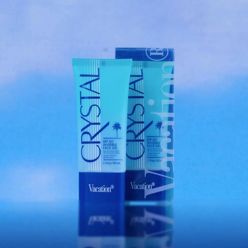 Vacation® Crystal SPF 50 Invisible Face Gel on a soft blue background