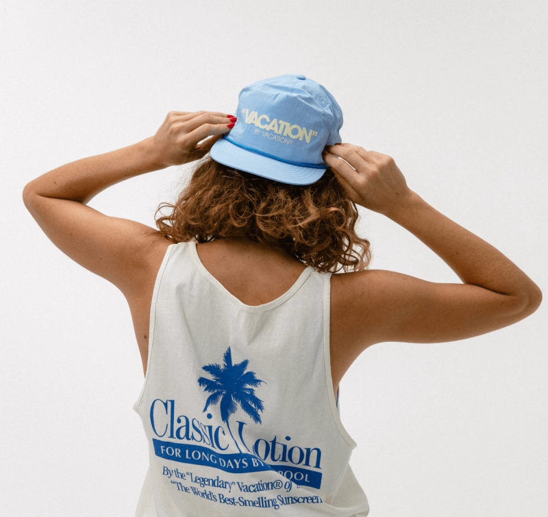 a woman wearing a tank top that says classic vacation