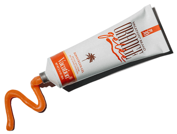 a tube of vacation brand sunscreen is being squeezed out