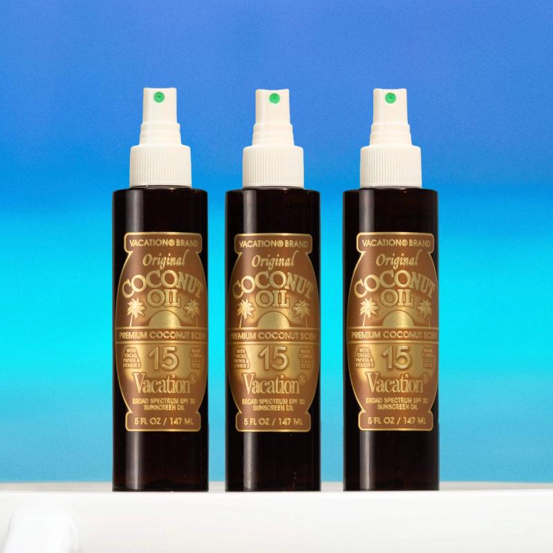 Three Vacation Brand Original Coconut Oil SPF 30 sunscreen bottles.