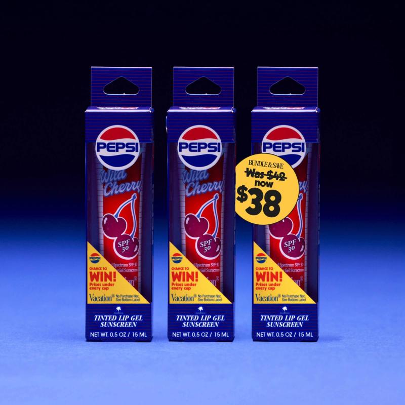 Three tubes of Pepsi Wild Cherry SPF 30 tinted lip gel sunscreen by Vacation, displayed in ice with a blue background. A yellow tag on one tube shows a $38 bundle price, marked down from $42.