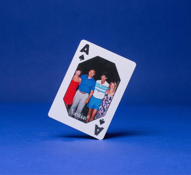 a playing card with a picture of a family on it